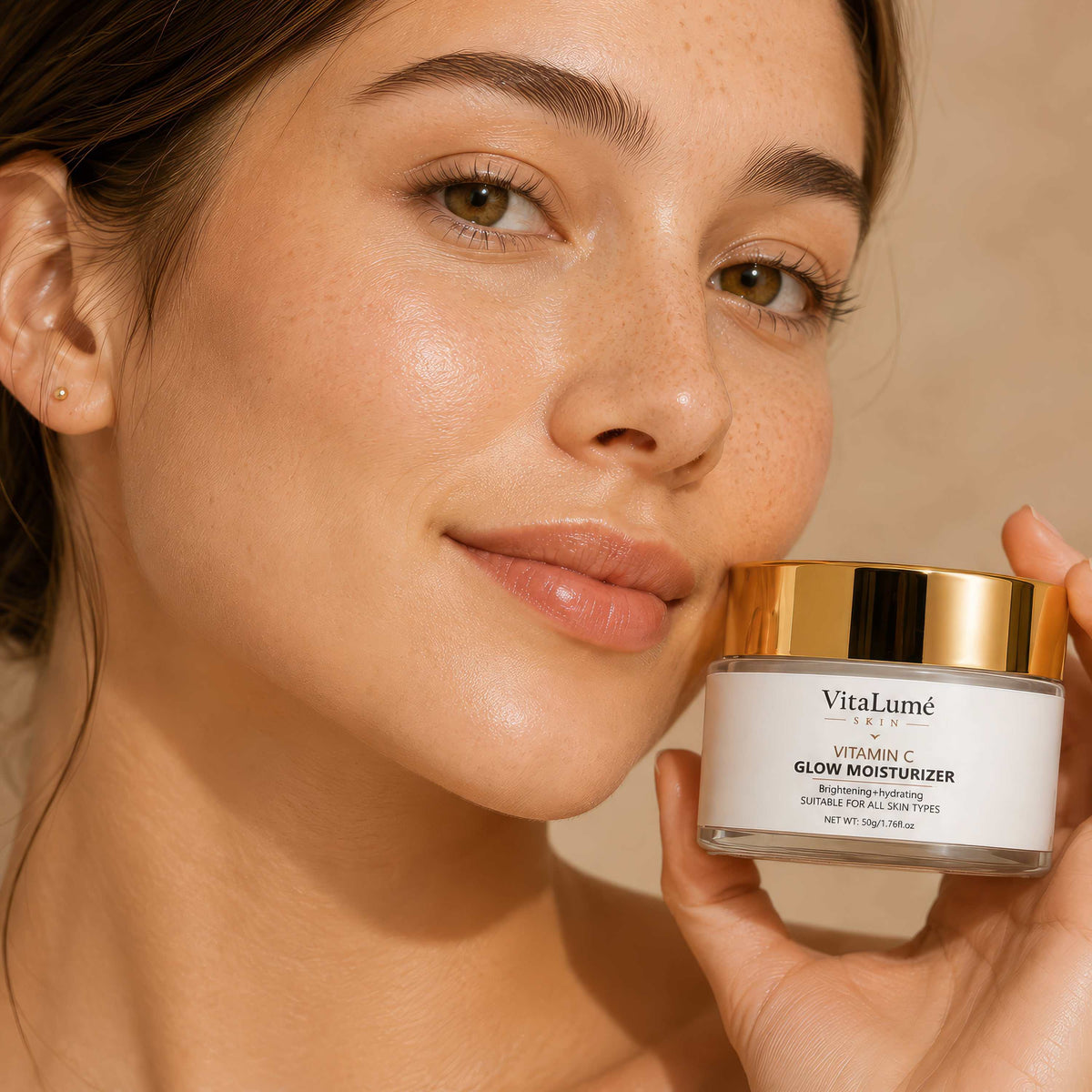 Glow Moisturizer in a white jar with a gold lid, featuring a Vitamin C label and a smooth, glossy finish