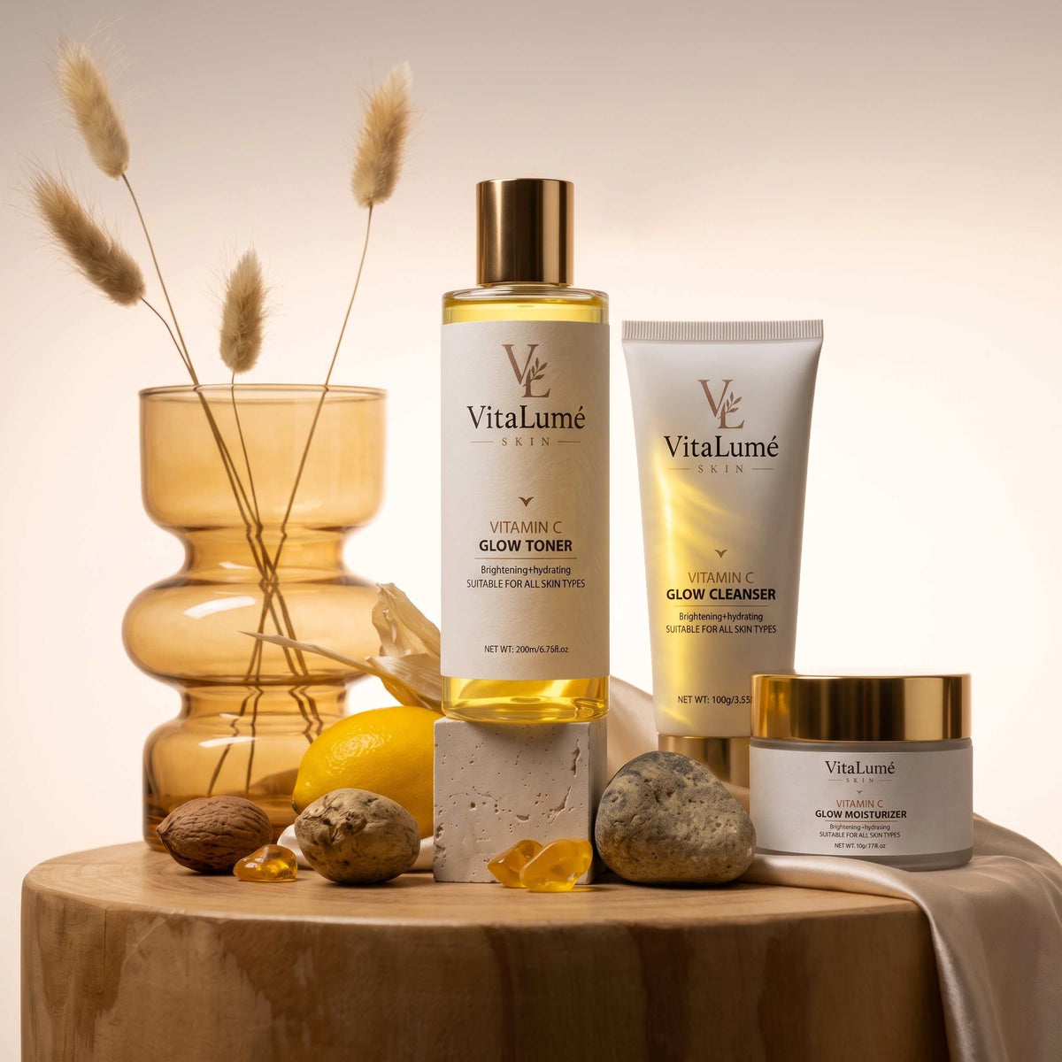 Skincare set featuring a golden toner bottle, cream cleanser tube and moisturizer jar for skin barrier repair